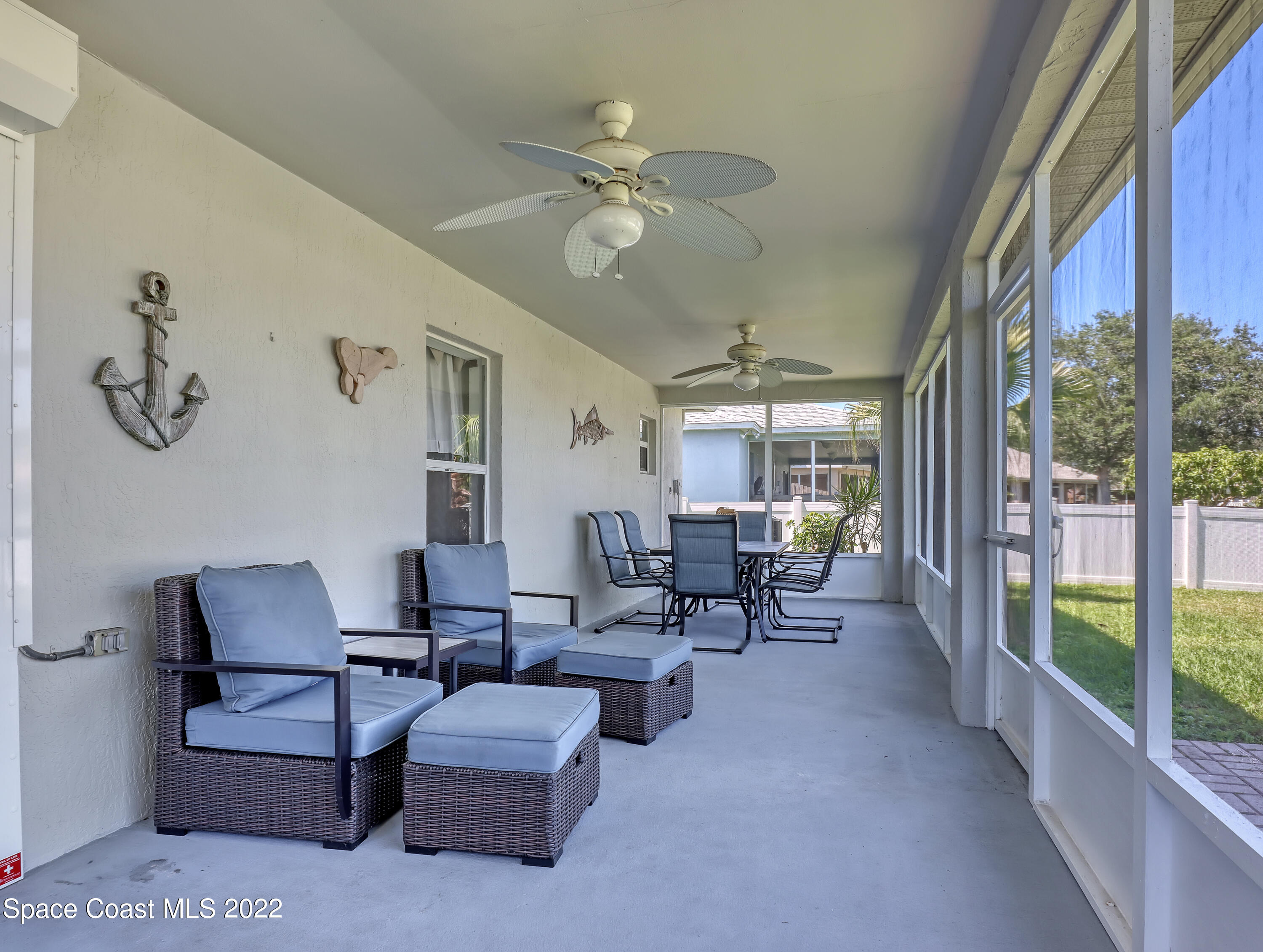 4920 Spinet Drive Melbourne, FL 32940 - Photo 29 of 44 a living room with furniture and a large window