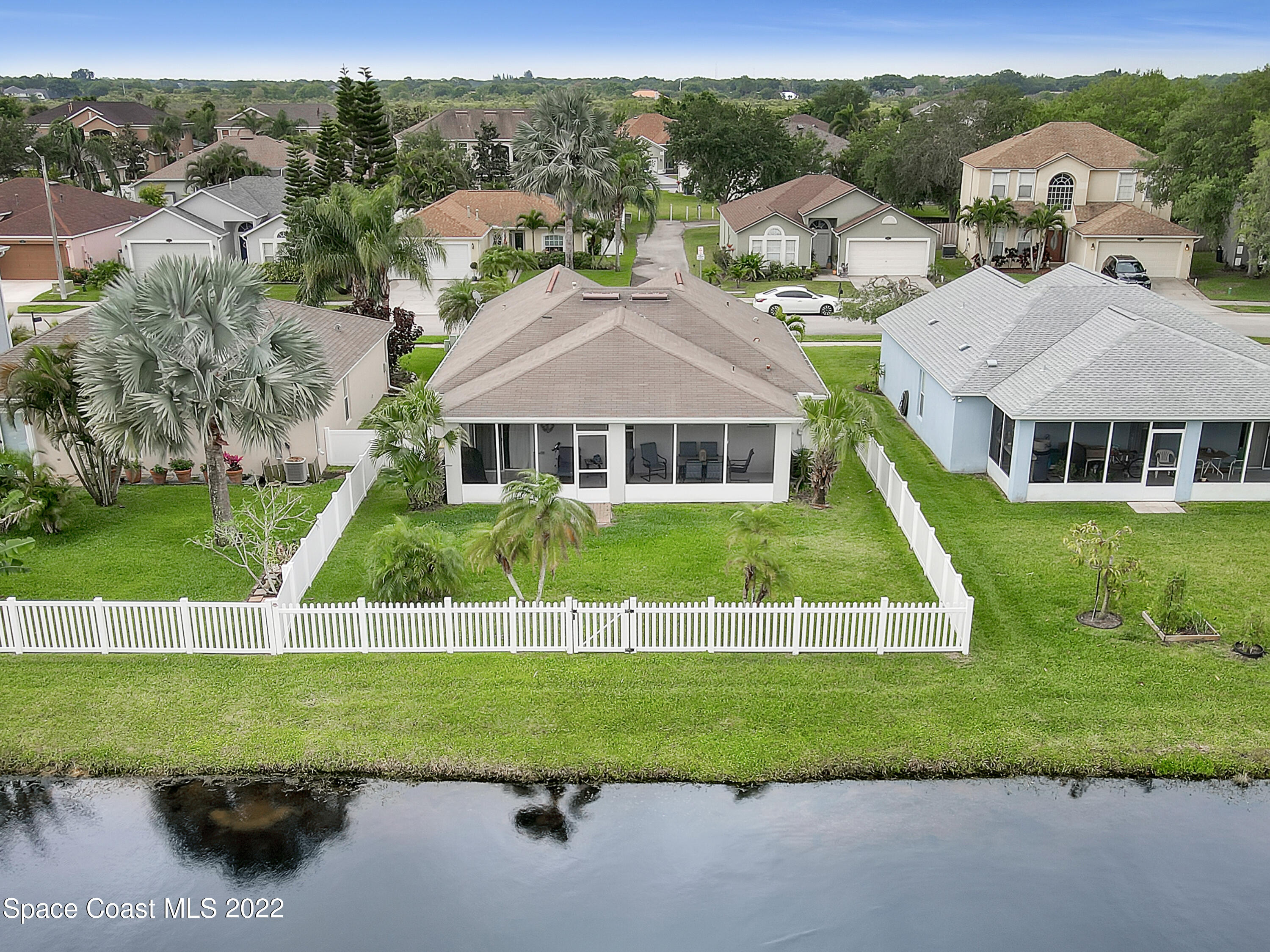 4920 Spinet Drive Melbourne, FL 32940 - Photo 3 of 44 a view of house with garden space and yard