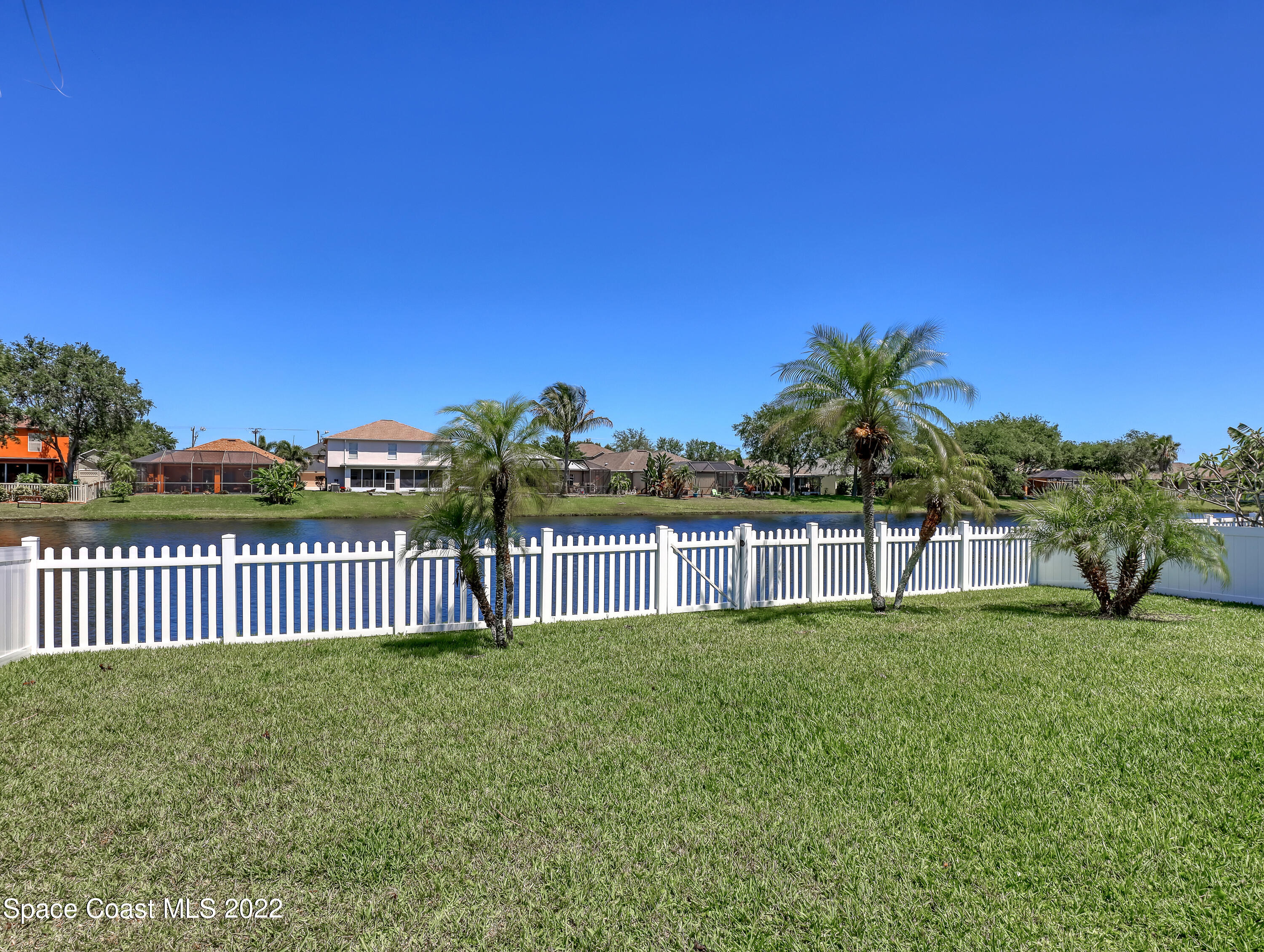 4920 Spinet Drive Melbourne, FL 32940 - Photo 32 of 44 a view of a garden with wooden fence