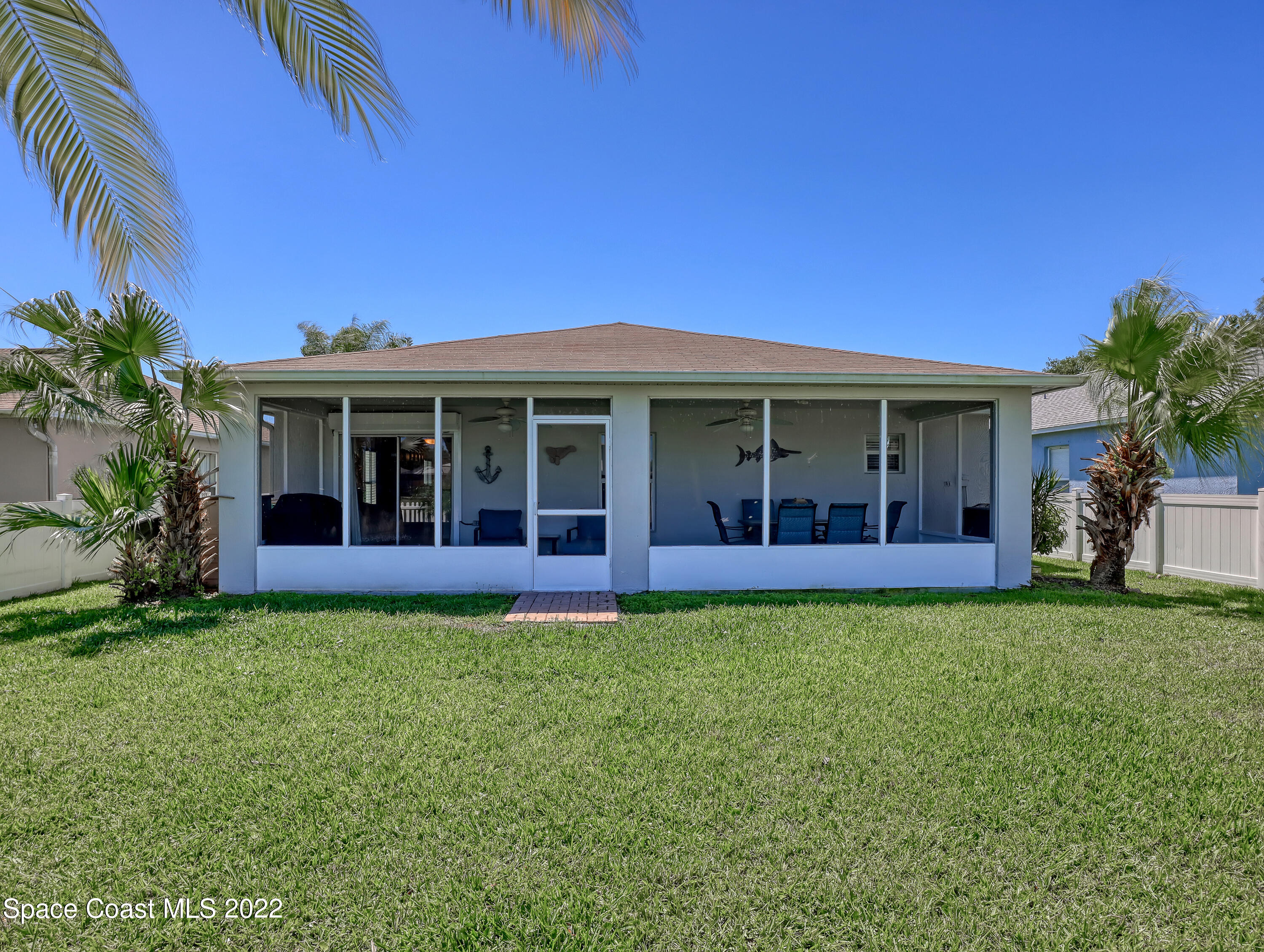 4920 Spinet Drive Melbourne, FL 32940 - Photo 34 of 44 a view of house with a big yard and potted plants