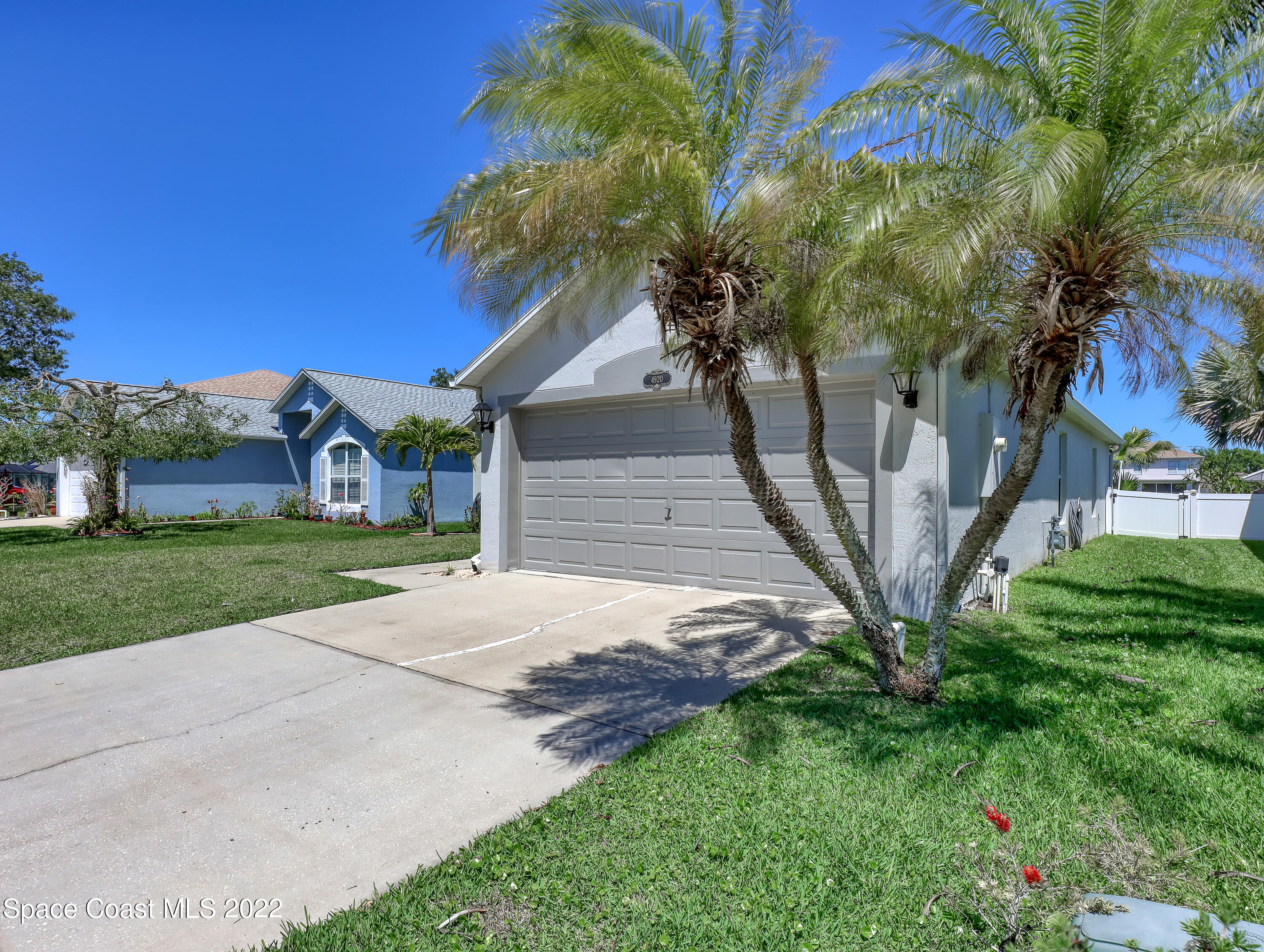 4920 Spinet Drive Melbourne, FL 32940 - Photo 38 of 44 a pathway of a house with a yard