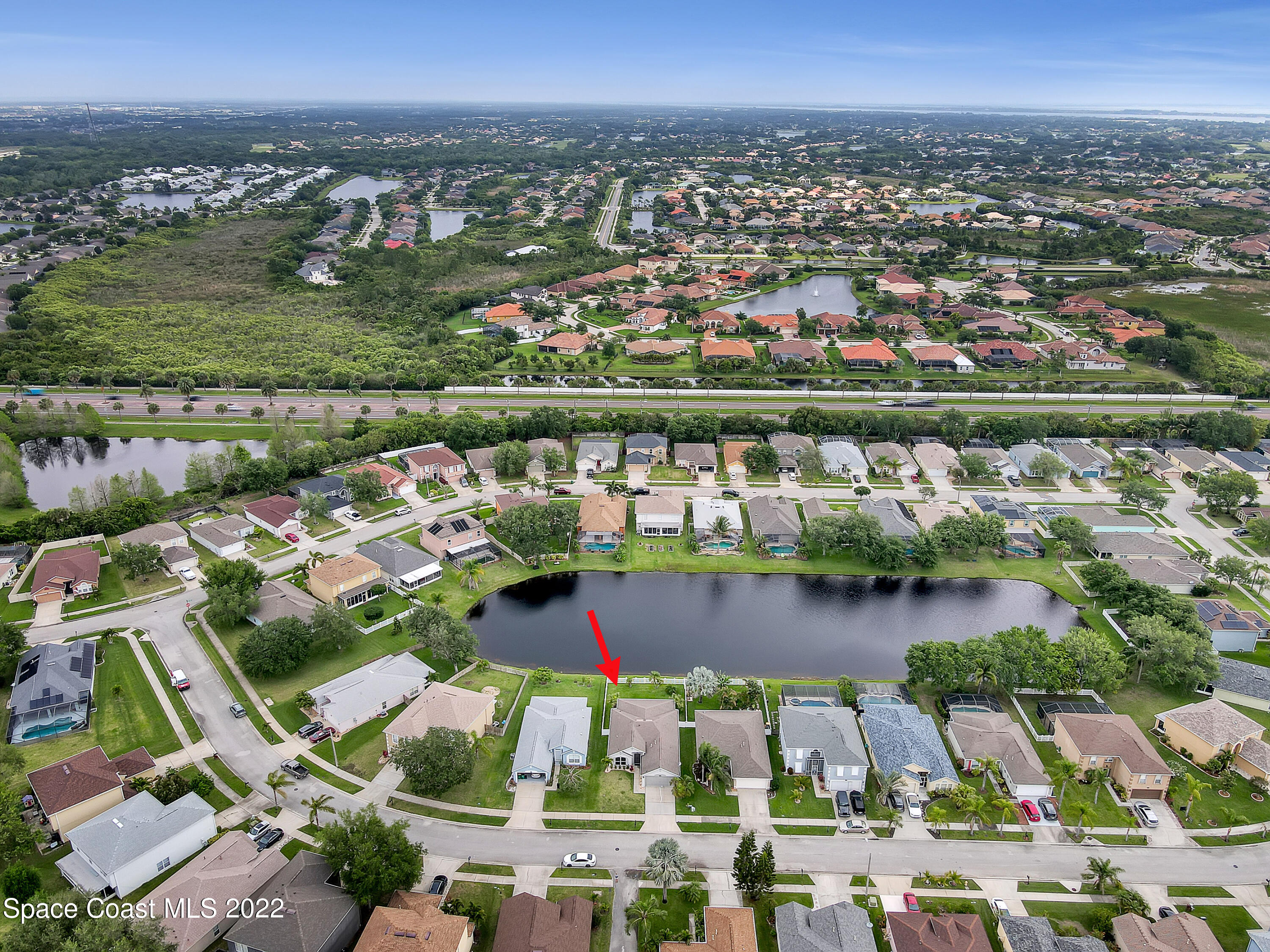 4920 Spinet Drive Melbourne, FL 32940 - Photo 41 of 44 an aerial view of residential houses with outdoor space and swimming pool
