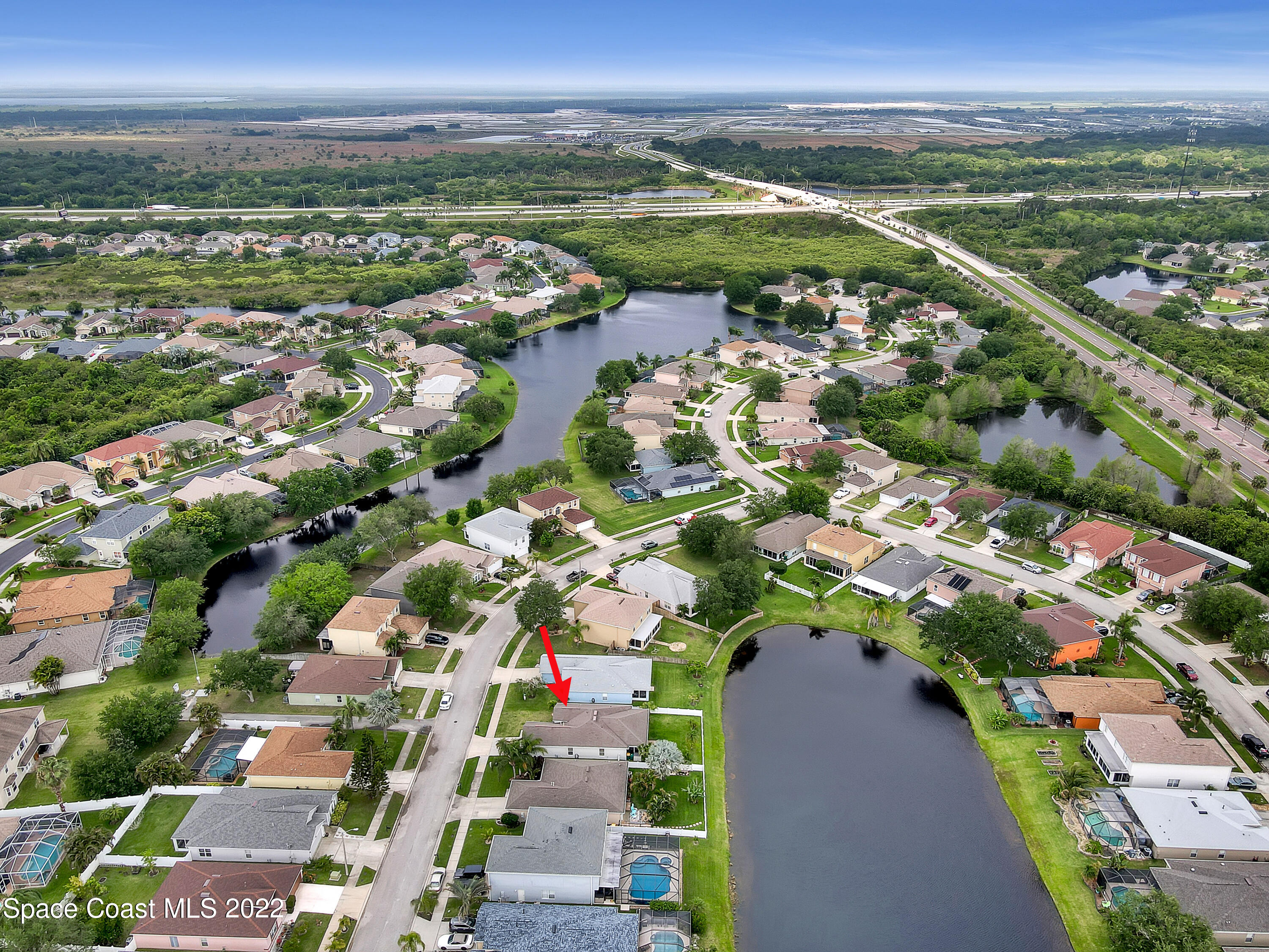 4920 Spinet Drive Melbourne, FL 32940 - Photo 42 of 44 an aerial view of residential houses with outdoor space