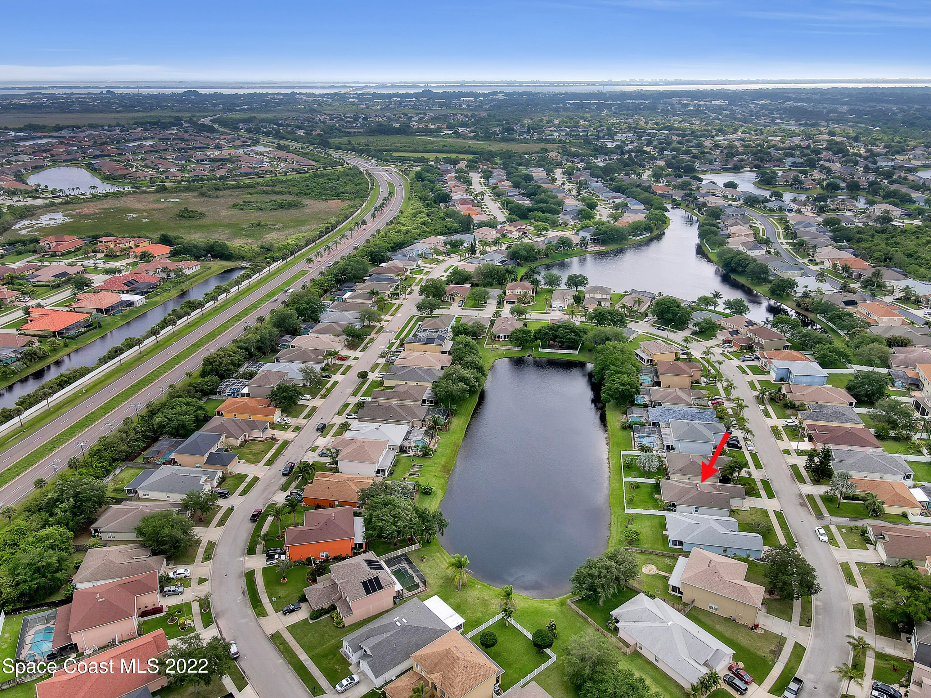 4920 Spinet Drive Melbourne, FL 32940 - Photo 44 of 44 an aerial view of residential houses with outdoor space