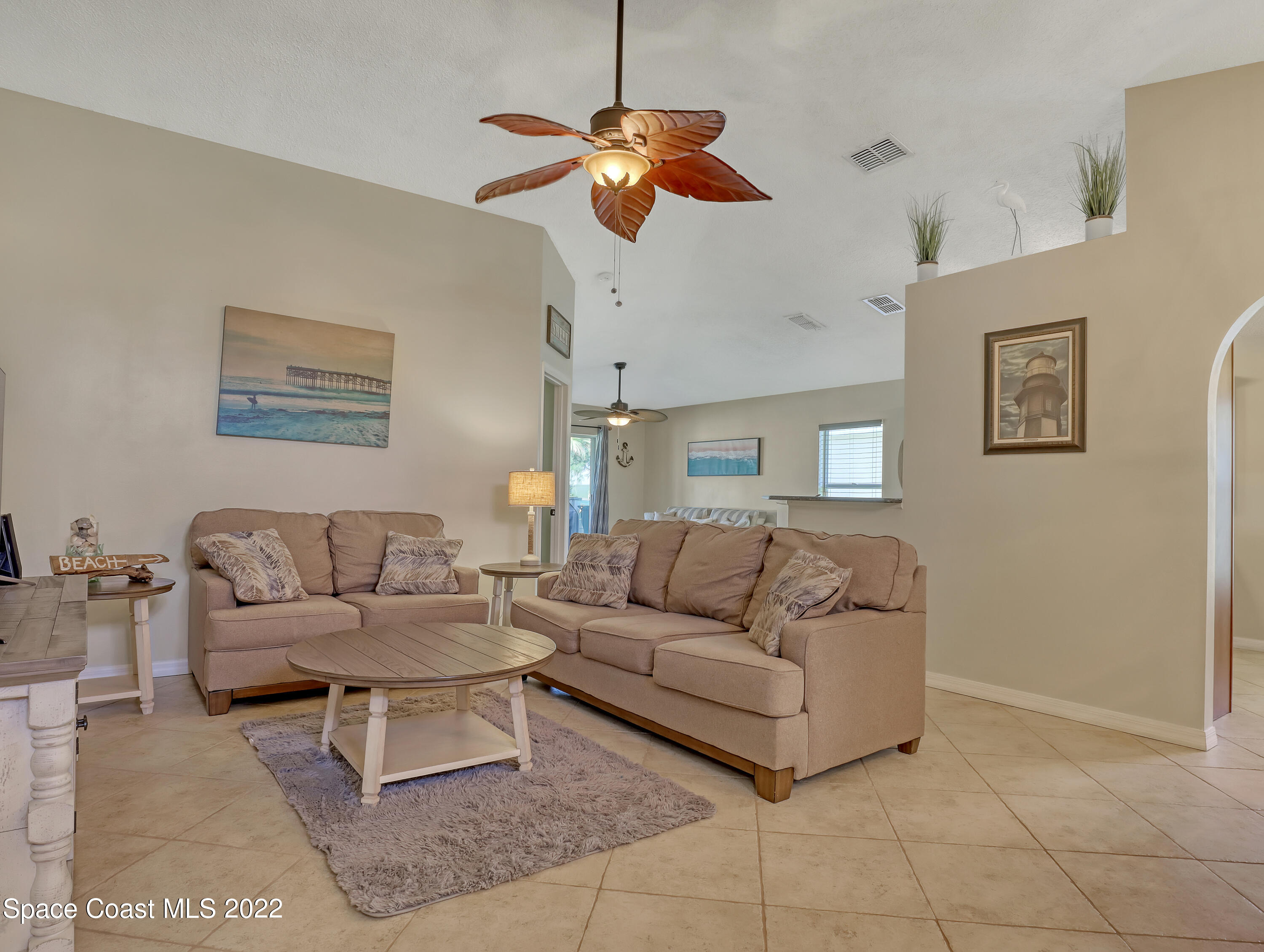 4920 Spinet Drive Melbourne, FL 32940 - Photo 5 of 44 a living room with furniture and a ceiling fan