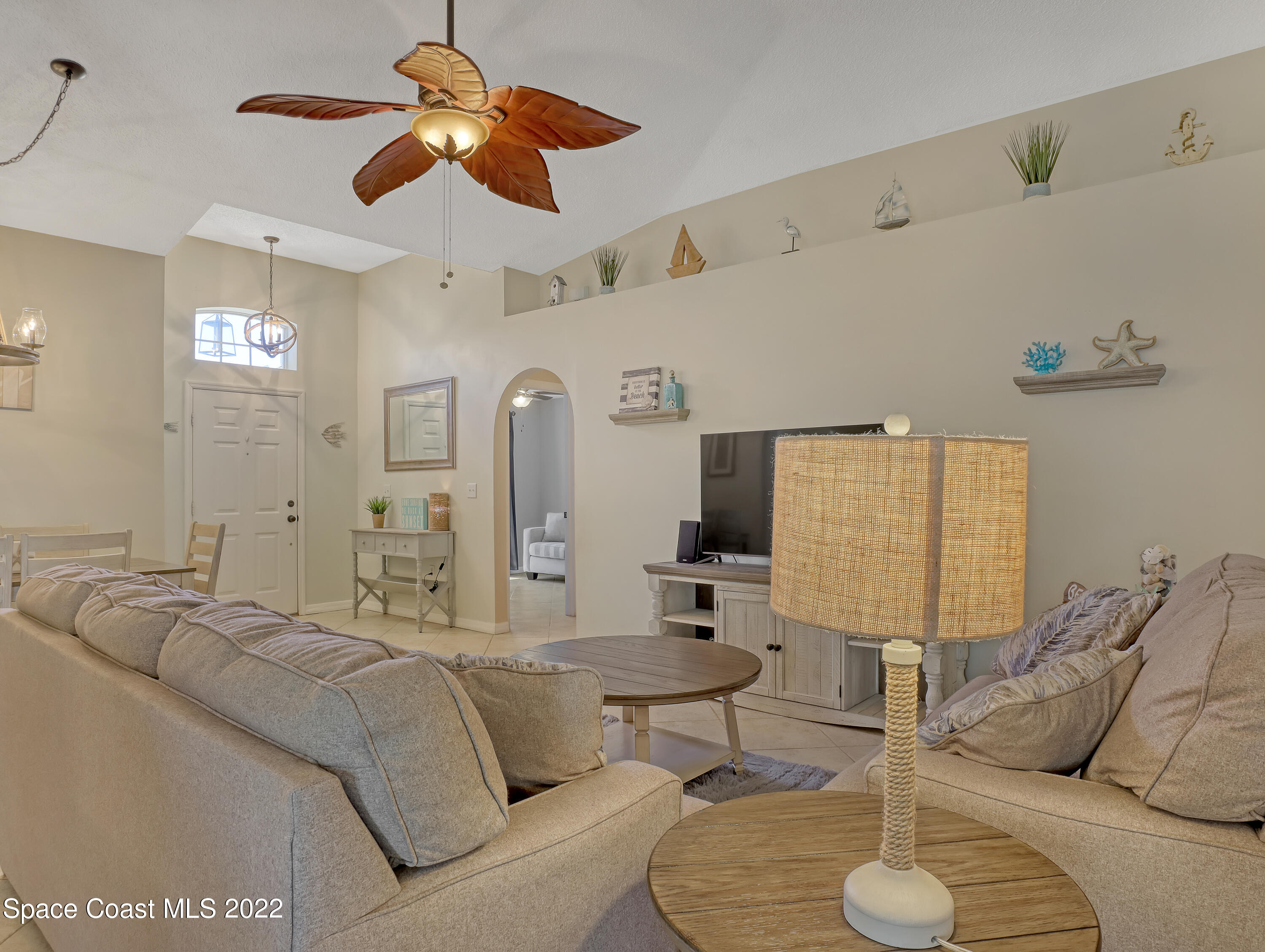 4920 Spinet Drive Melbourne, FL 32940 - Photo 6 of 44 a living room with furniture and a large window