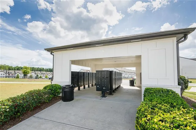 a porch with a table and chairs