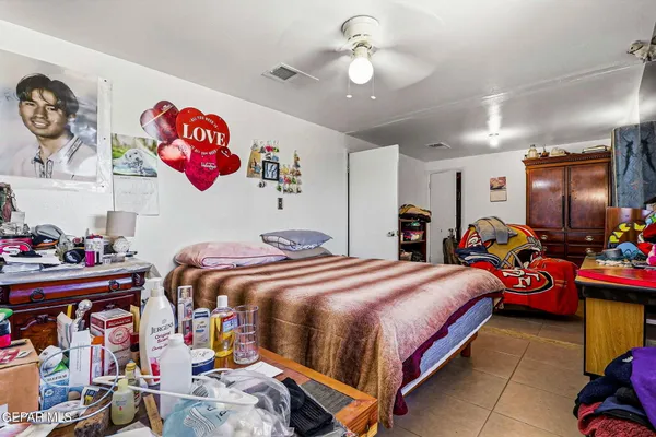 a bedroom with bed and furniture