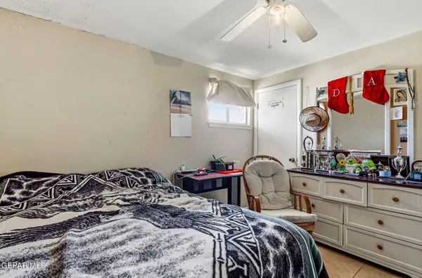 a bedroom with a bed and furniture