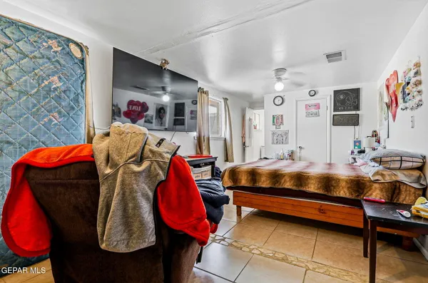a bedroom with a bed and a closet