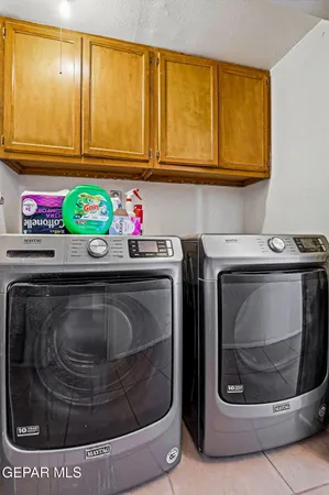 a utility room with washer and dryer