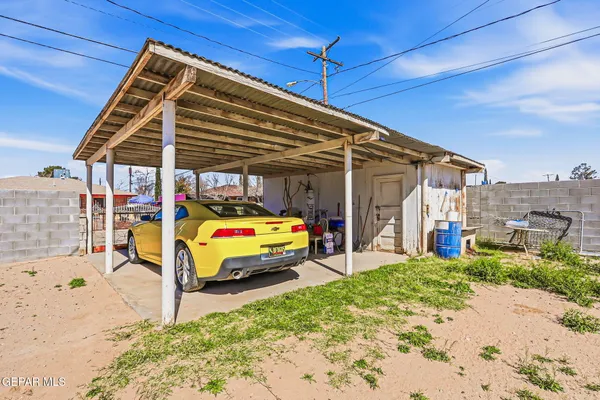 a view of backyard with a patio