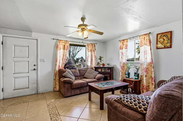 a living room with furniture and a large window