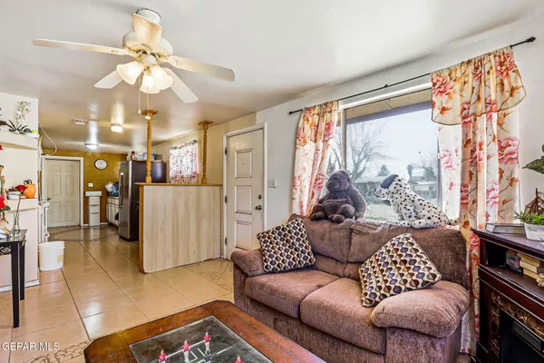 a living room with furniture and a large window