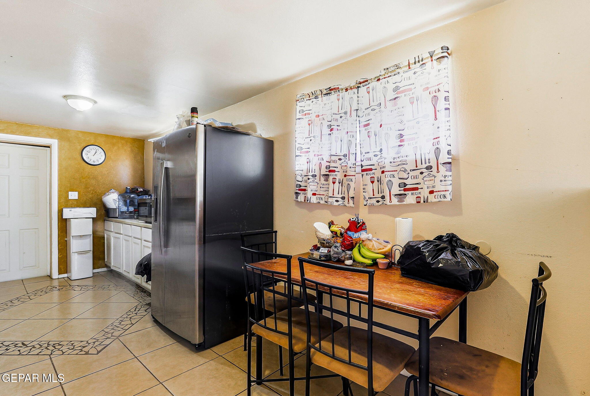 501 South 8th Street Anthony, TX 79821 - Photo 8 of 37 a kitchen with stainless steel appliances granite countertop a refrigerator and a sink