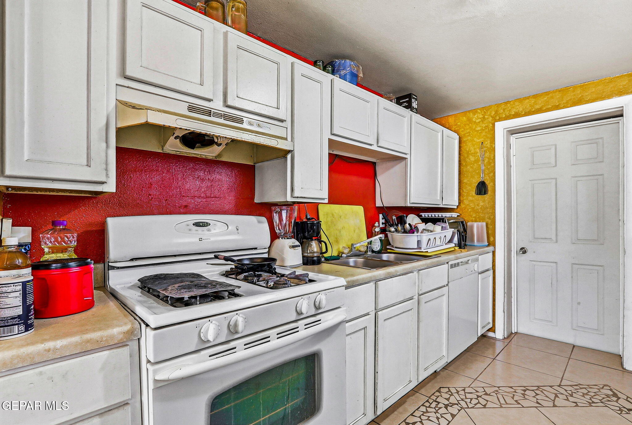 501 South 8th Street Anthony, TX 79821 - Photo 9 of 37 a kitchen with stainless steel appliances granite countertop a stove and cabinets