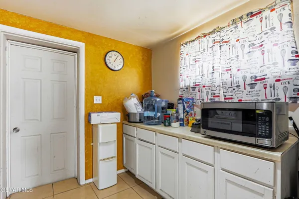 a kitchen with stainless steel appliances granite countertop a stove and a microwave