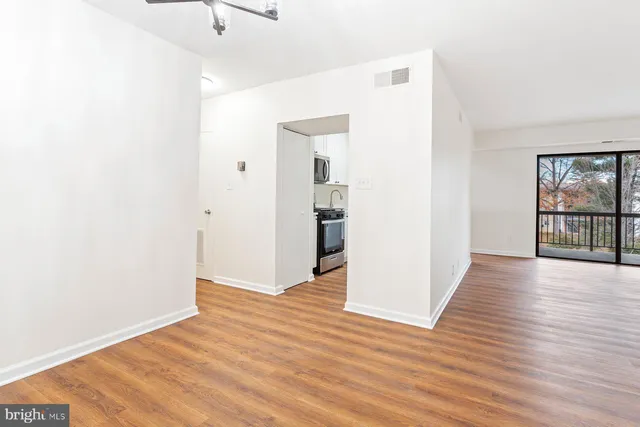 a view of a hardwood floor in a room