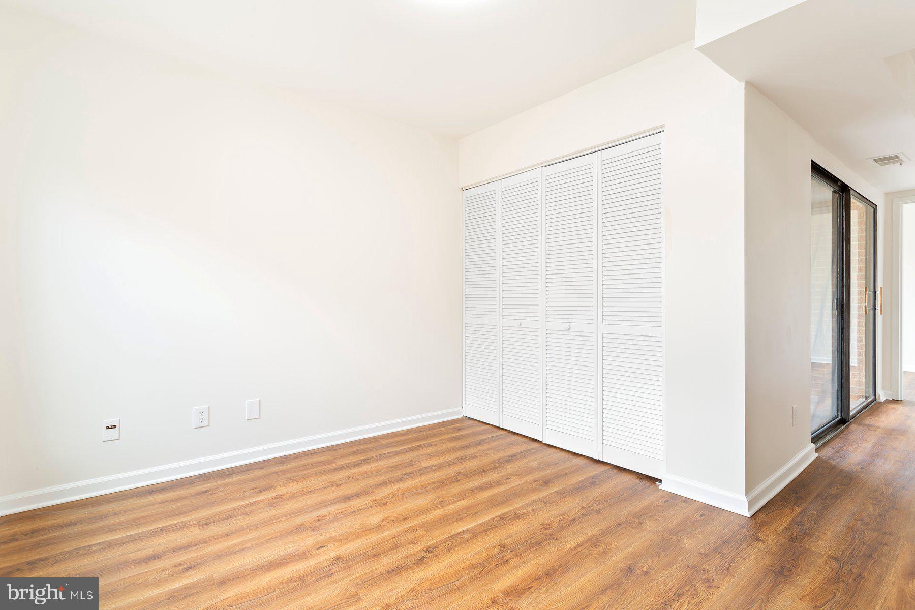 11234 Cherry Hill Road, Unit 304 Beltsville, MD 20705 - Photo 20 of 28 a view of empty room with wooden floor