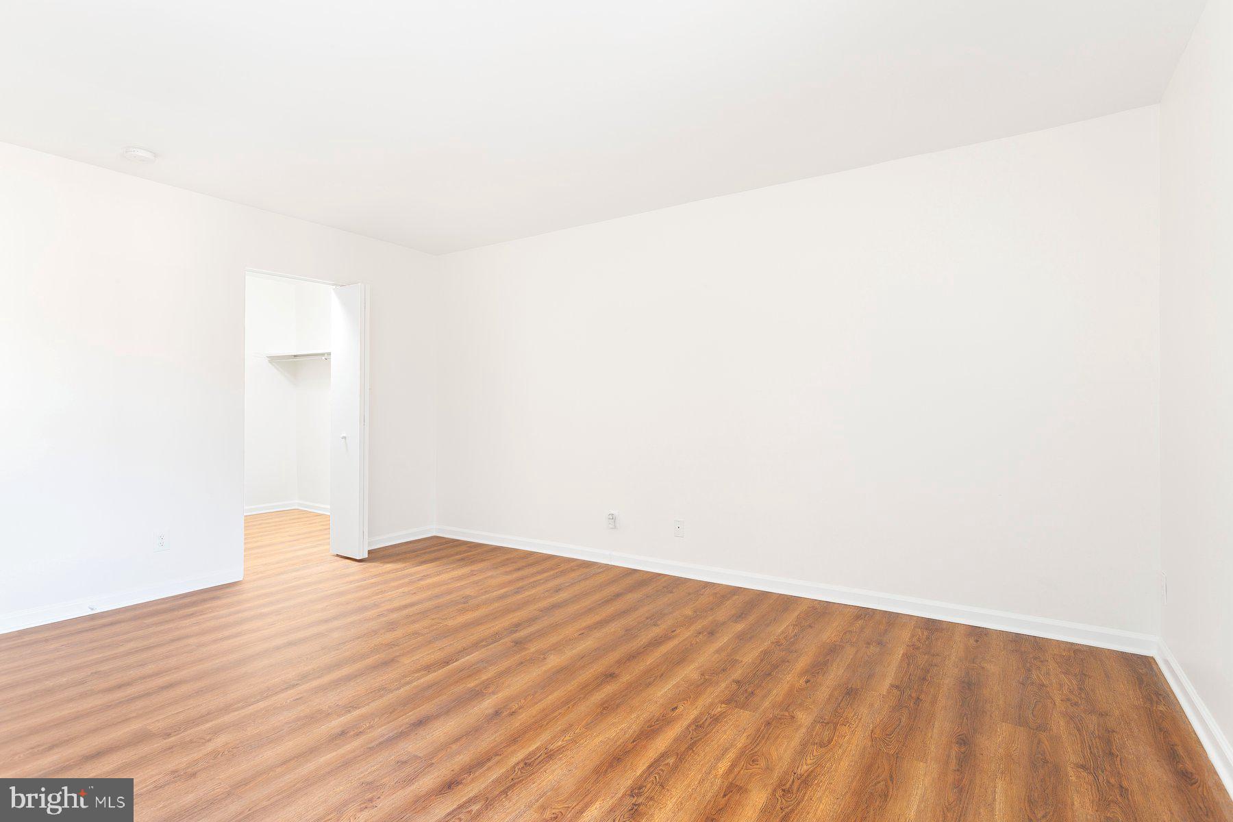 11234 Cherry Hill Road, Unit 304 Beltsville, MD 20705 - Photo 26 of 28 a view of empty room with wooden floor