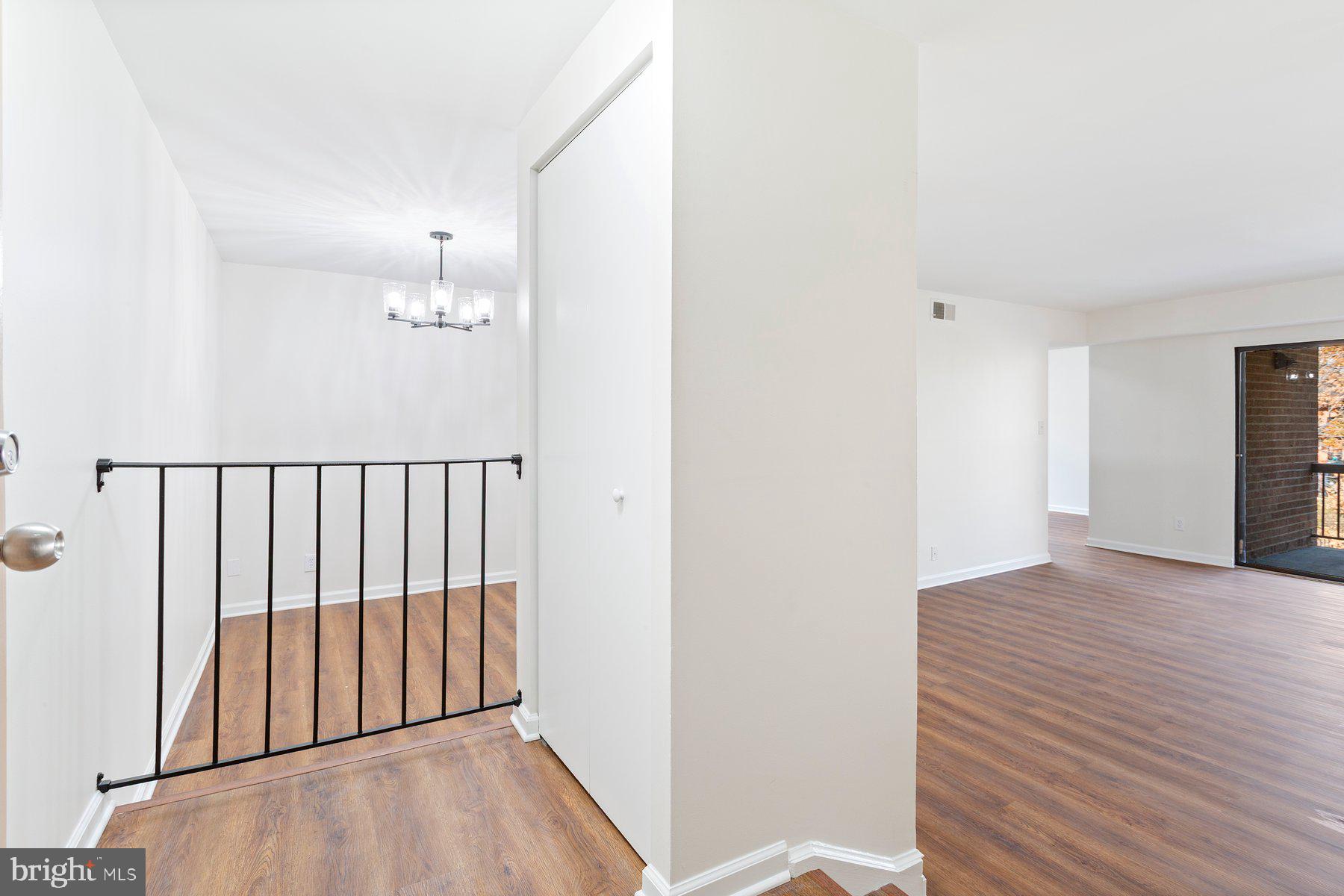 11234 Cherry Hill Road, Unit 304 Beltsville, MD 20705 - Photo 3 of 28 a view of a room with wooden floor
