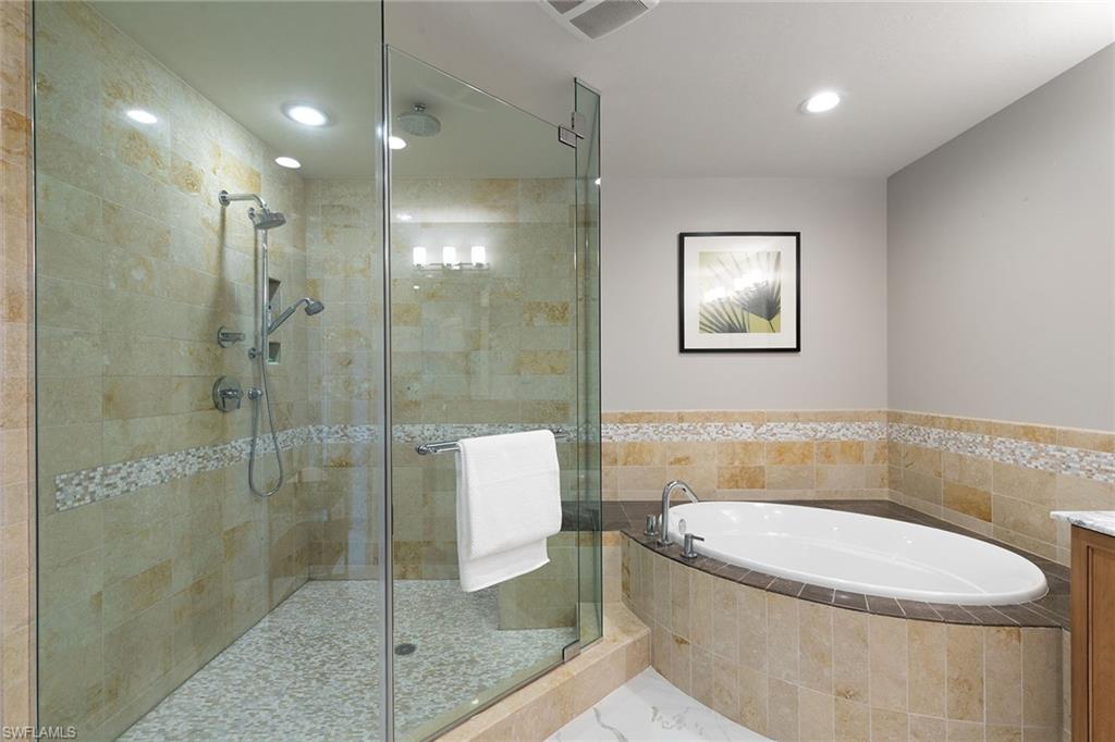 9123 Strada Place, Unit 7510 Naples, FL 34108 - Photo 17 of 38 Bathroom featuring a bath, a shower stall, vanity, and recessed lighting