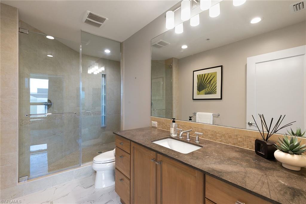 9123 Strada Place, Unit 7510 Naples, FL 34108 - Photo 21 of 38 Full bathroom featuring vanity, a stall shower, and recessed lighting