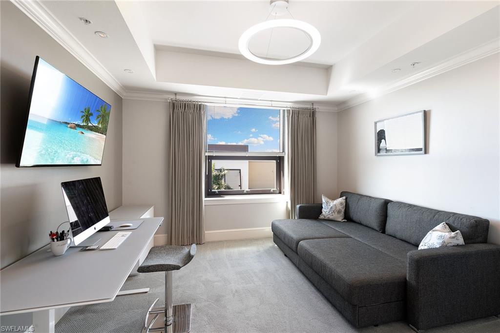 9123 Strada Place, Unit 7510 Naples, FL 34108 - Photo 22 of 38 Office with ornamental molding, carpet flooring, and a tray ceiling