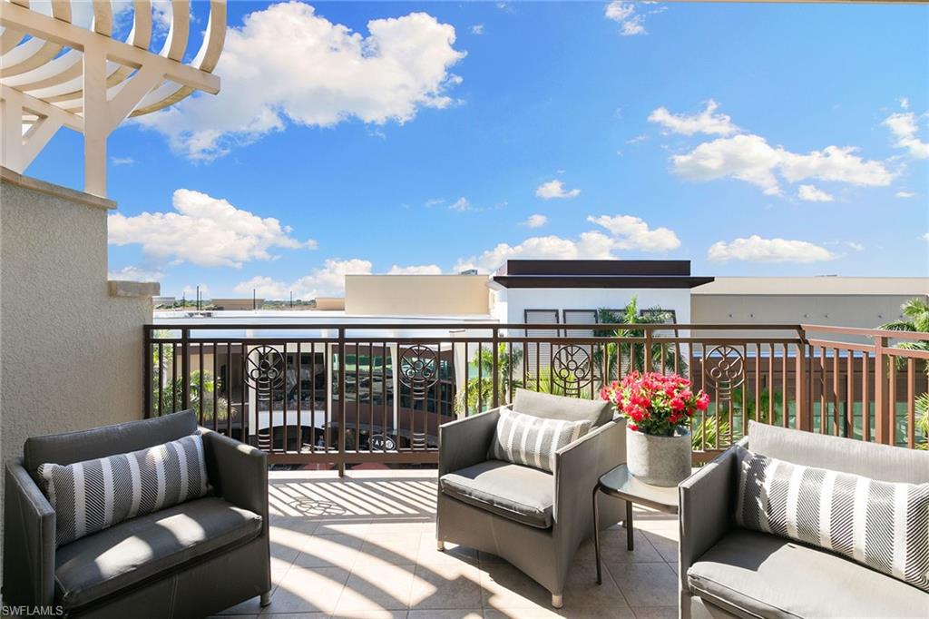 9123 Strada Place, Unit 7510 Naples, FL 34108 - Photo 26 of 38 Balcony featuring an outdoor lounge area