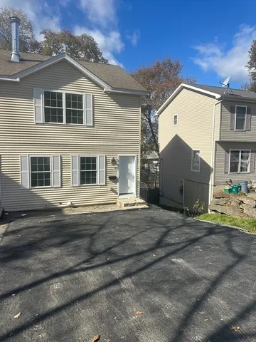 a view of a house with a street