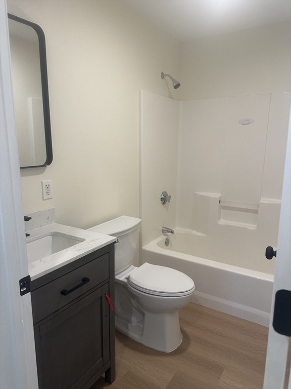 33 Denmark Street, Unit 33 Worcester, MA 01605 - Photo 6 of 10 a bathroom with a sink a toilet and shower
