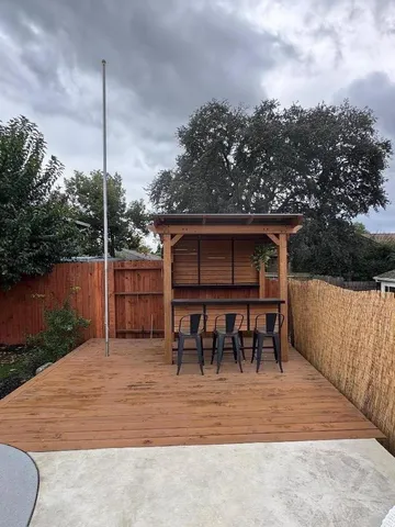 a view of a chairs and table in the patio