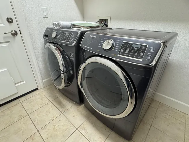 a utility room with dryer and washer