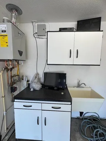 a kitchen with a stove and a sink