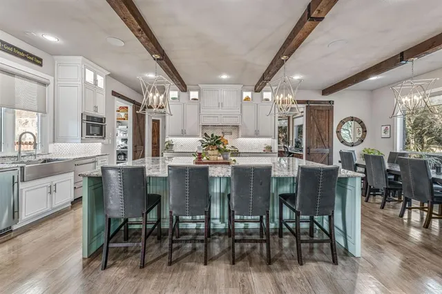 a view of a dining area with furniture and wooden floor