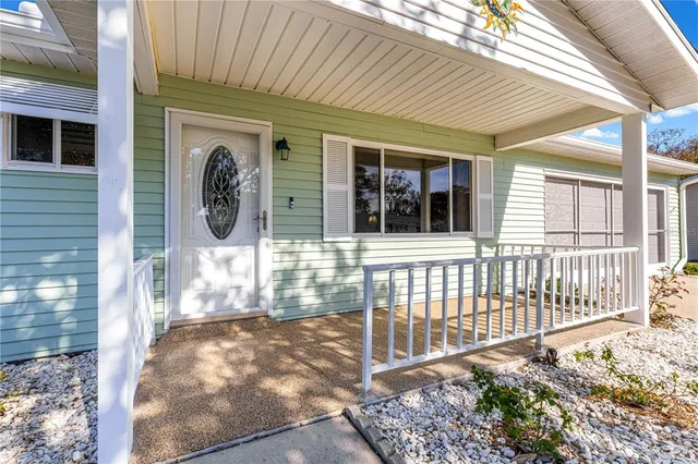 a front view of a house with a porch