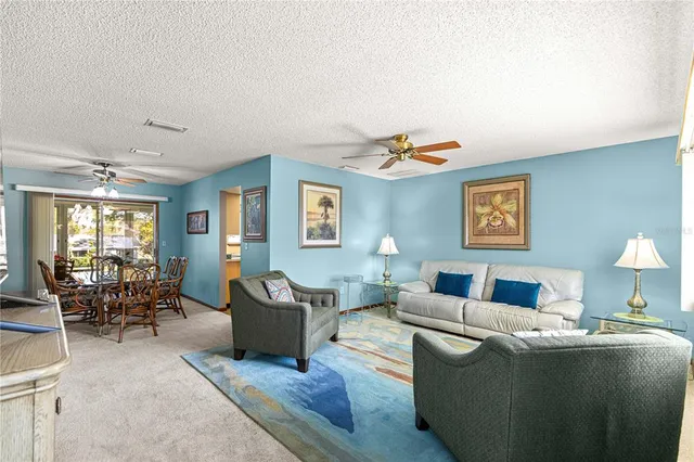 a living room with furniture and a table