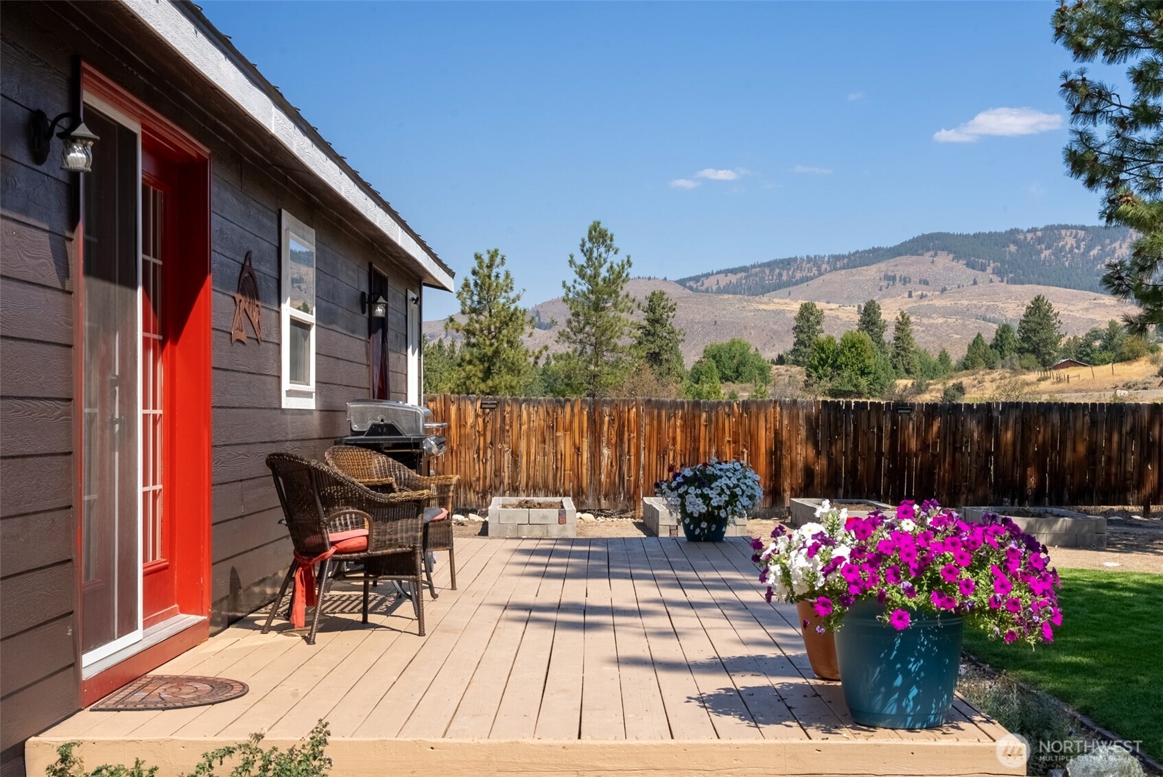 a view of a chairs and tables in the back yard of the house