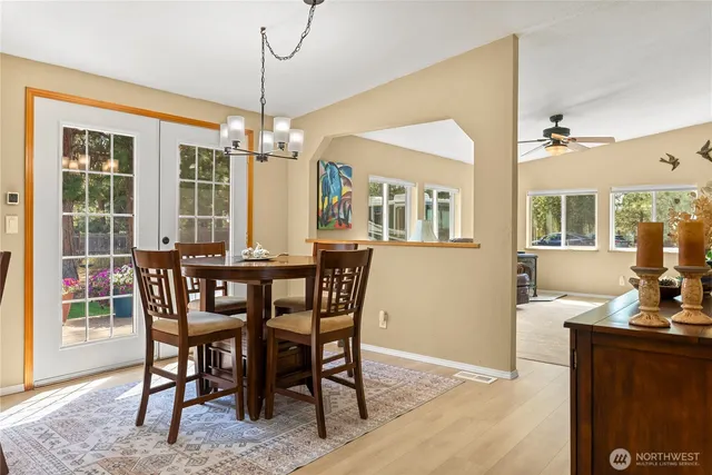a view of a dining room with furniture window and wooden floor