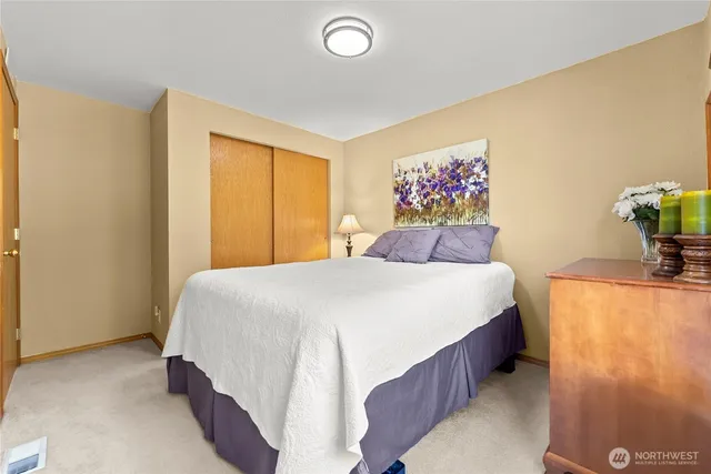 a bedroom with a bed and a couch