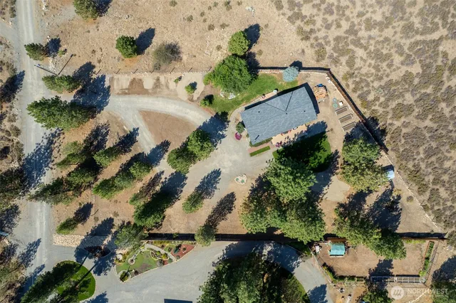 an aerial view of house with a yard
