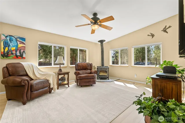 a living room with furniture and a large window