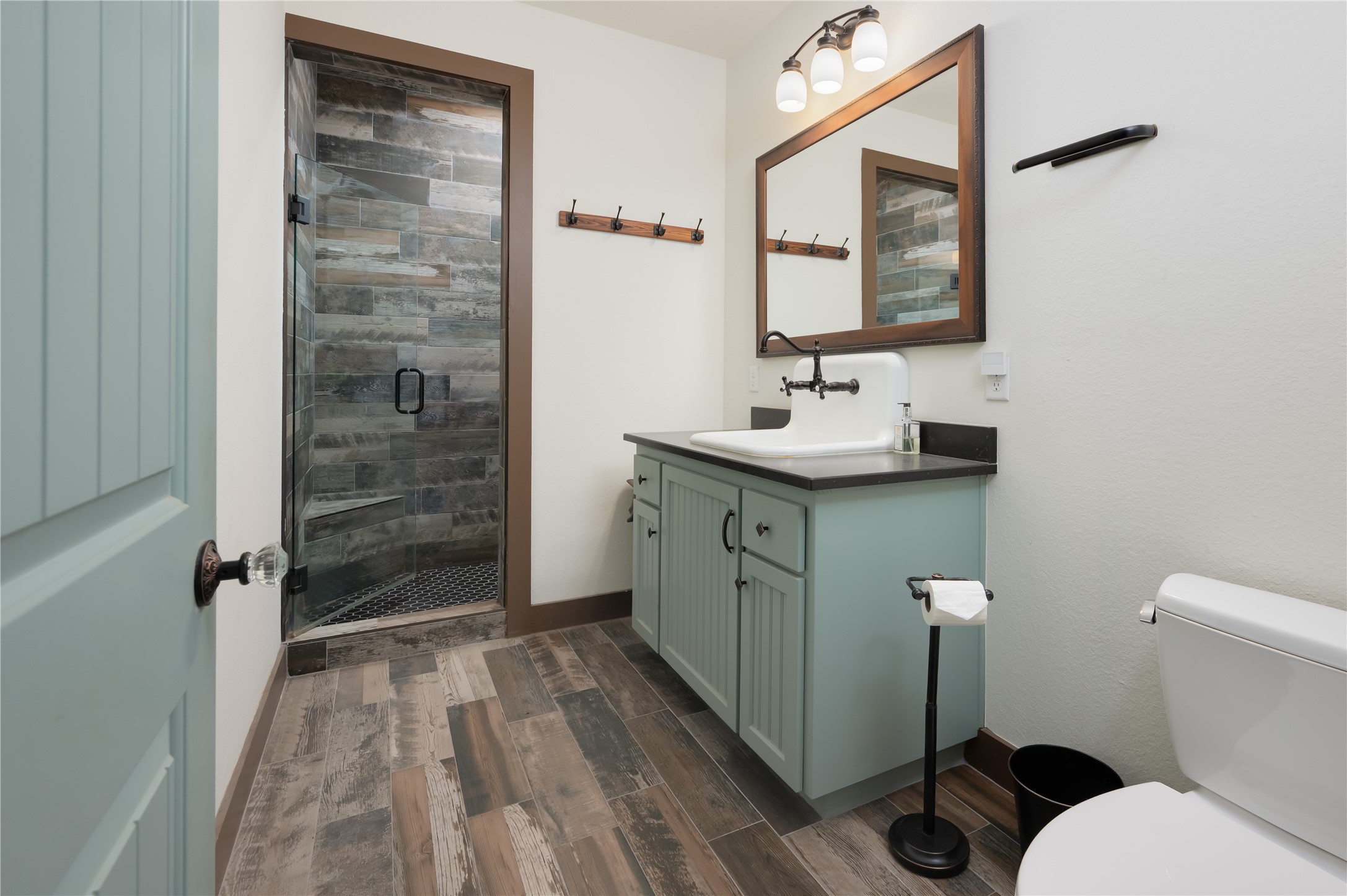 270 Dry Creek Road Manor, TX 78653 - Photo 17 of 40 A well-appointed bath features a spacious glass-enclosed shower and a vanity with ample storage.
