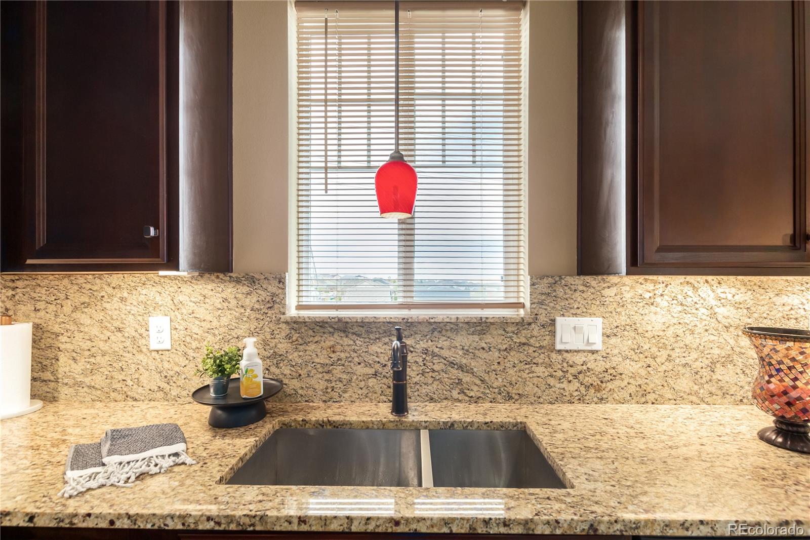 24389 East Brandt Avenue Aurora, CO 80016 - Photo 16 of 49 a bathroom with a sink and a granite top