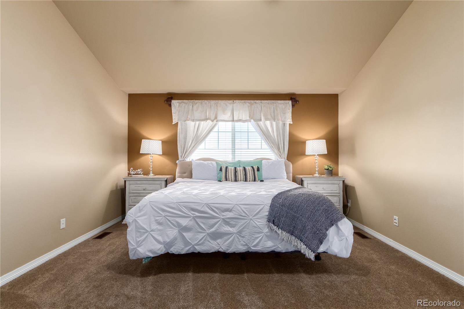 24389 East Brandt Avenue Aurora, CO 80016 - Photo 20 of 49 a bedroom with a bed and a window