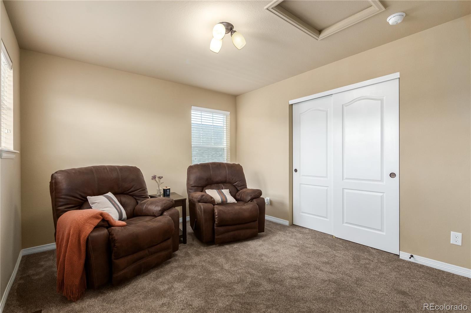 24389 East Brandt Avenue Aurora, CO 80016 - Photo 34 of 49 a living room with furniture and a window
