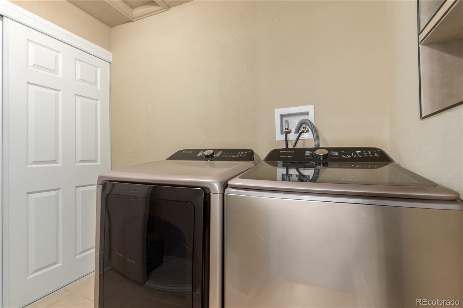 24389 East Brandt Avenue Aurora, CO 80016 - Photo 41 of 49 a close view of sink and washer