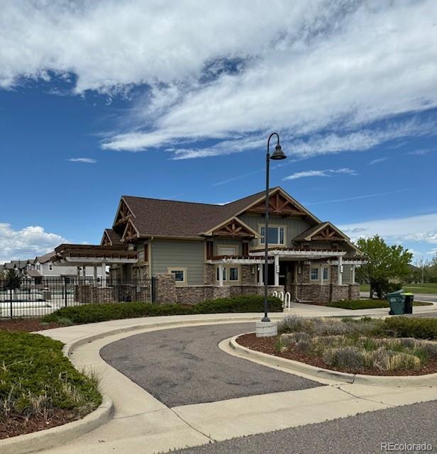 24389 East Brandt Avenue Aurora, CO 80016 - Photo 48 of 49 a front view of a house with a yard