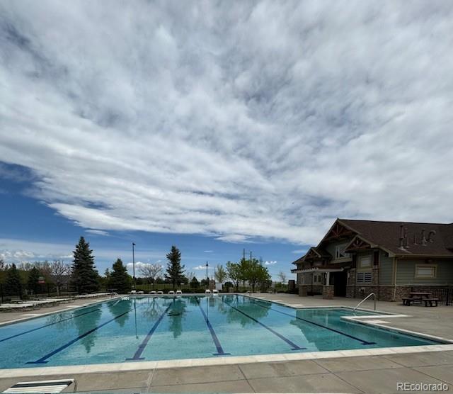 24389 East Brandt Avenue Aurora, CO 80016 - Photo 49 of 49 a view of a big house with a big yard and large trees