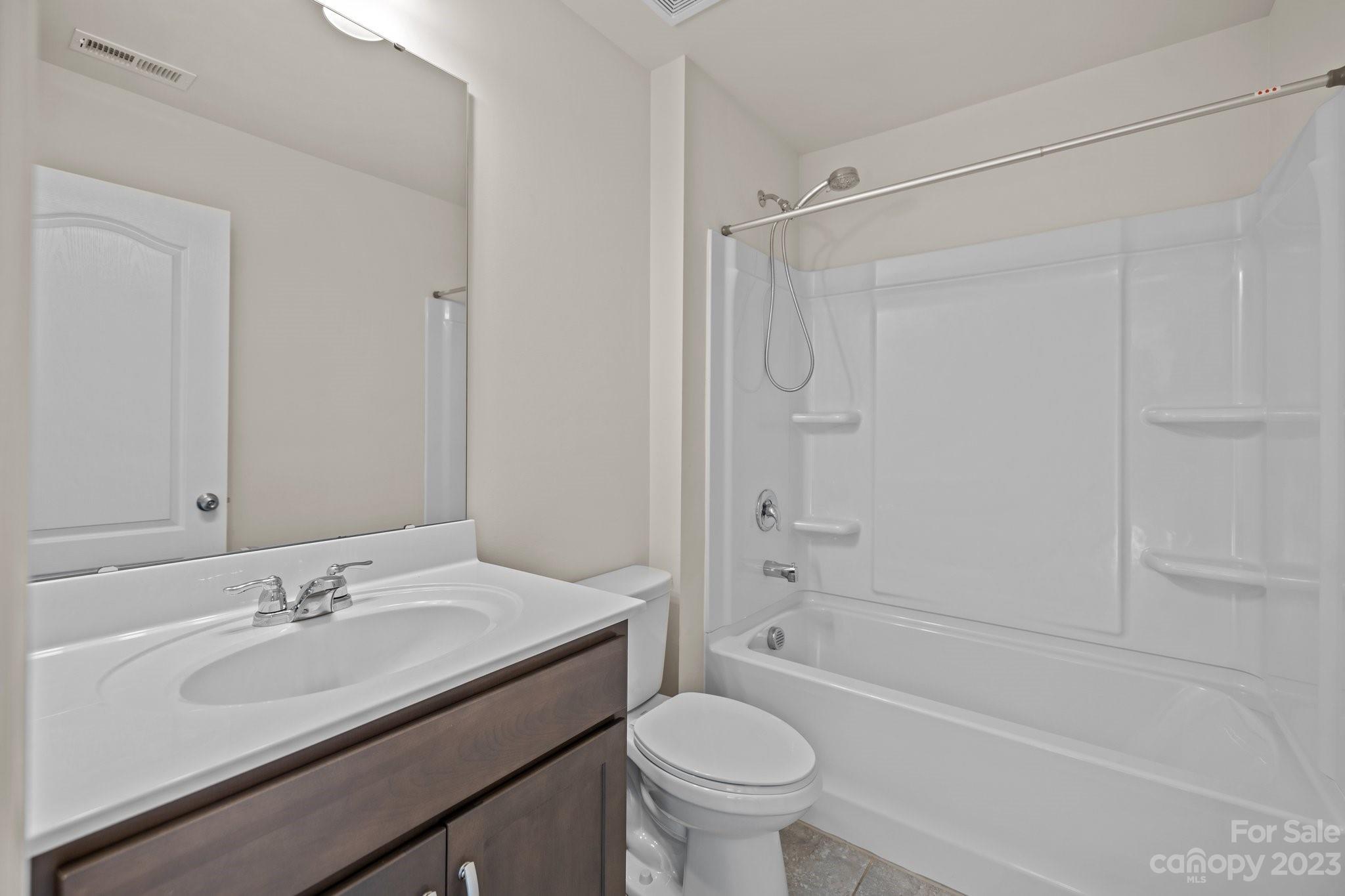 137 Hampton Trail Drive Fort Mill, SC 29708 - Photo 23 of 48 a bathroom with a sink toilet vanity and shower
